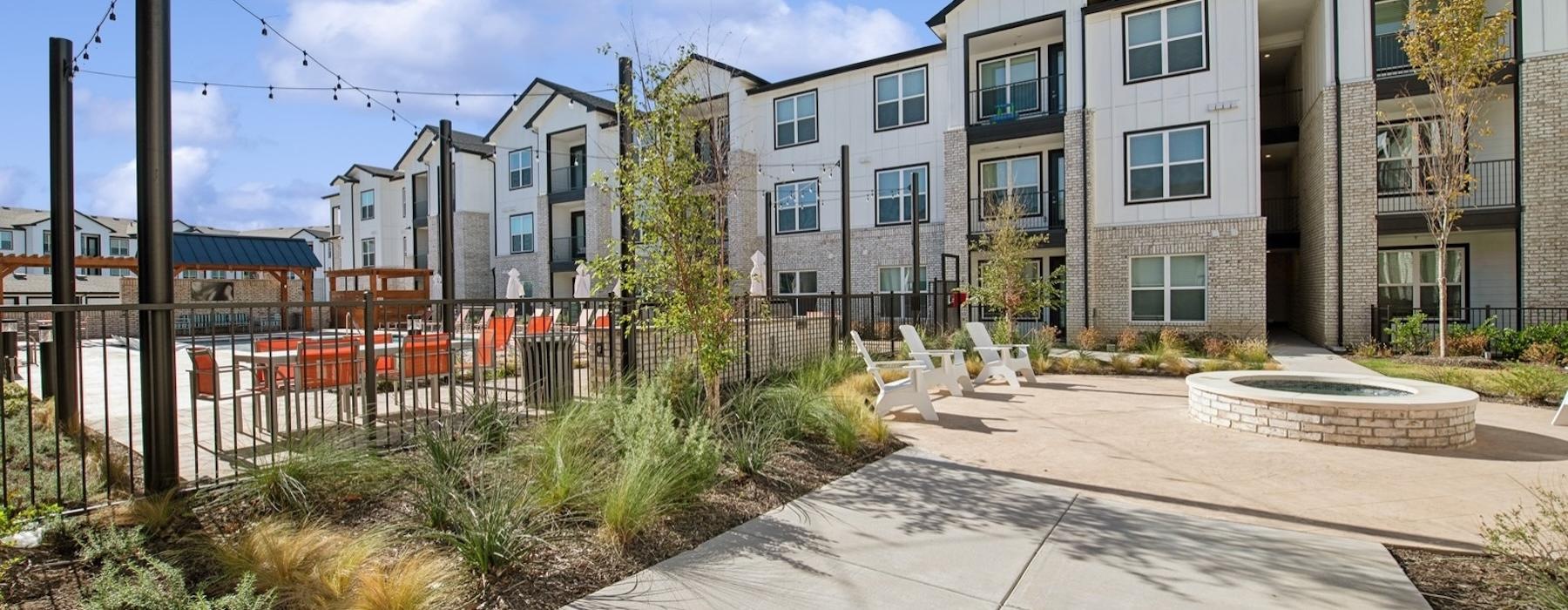a sidewalk and a fence