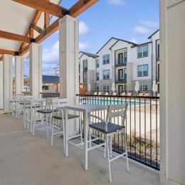 a patio with tables and chairs