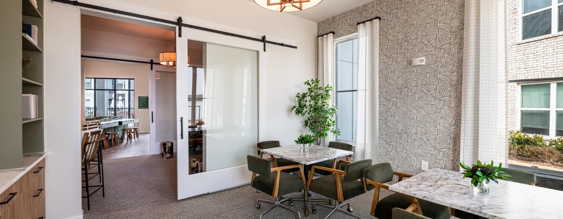 a room with a table and chairs