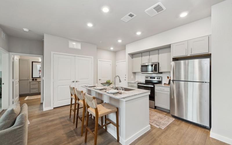 a kitchen with white cabinets